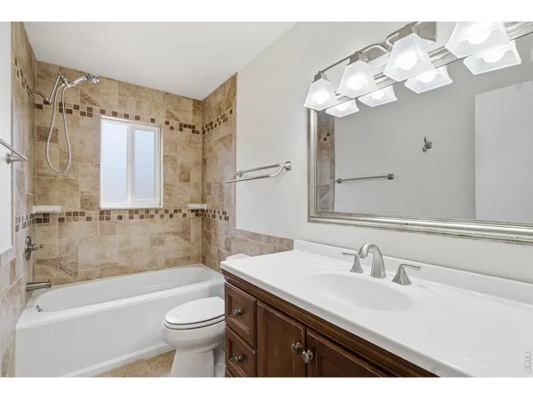 a bathroom with a sink a toilet and a bathtub