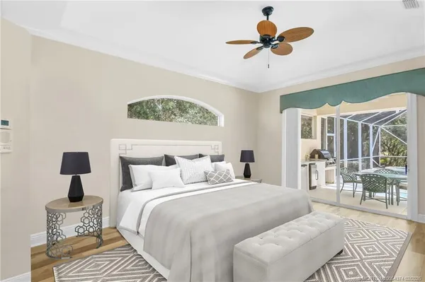 a bedroom with a large bed and a window