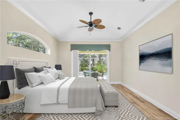 a spacious bathroom with a tub sink and mirror