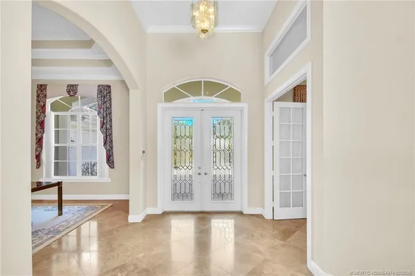 a view of an entryway with wooden floor