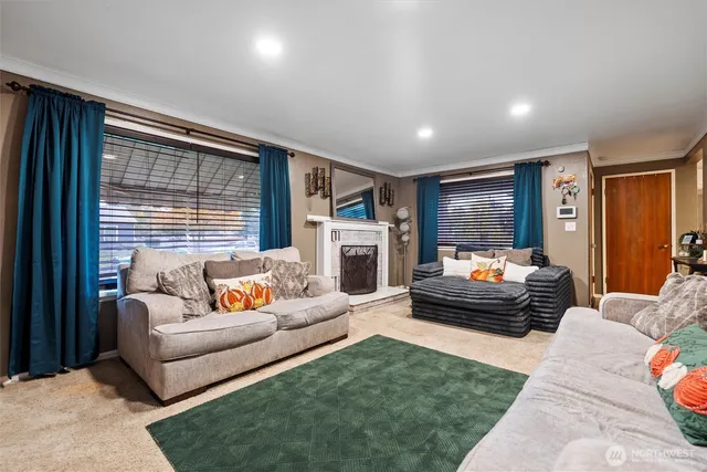 a living room with furniture fireplace and a flat screen tv