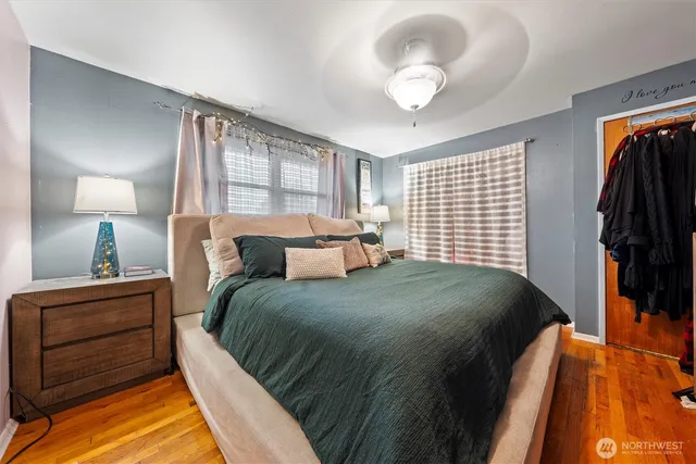 a bedroom with a bed and a lamp