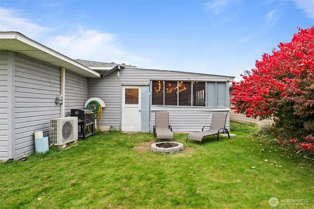 a view of a house with a backyard