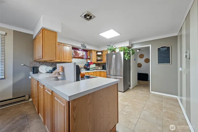 a kitchen with stainless steel appliances a sink stove and refrigerator