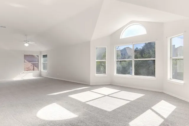 a view of a room with a large window