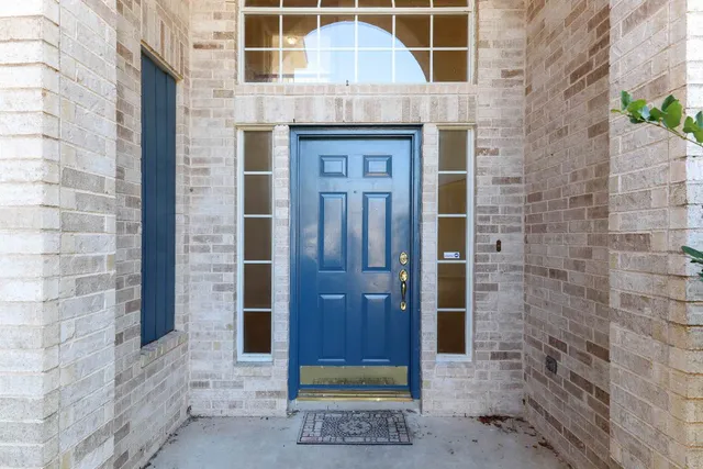 a view of entryway with a wooden door