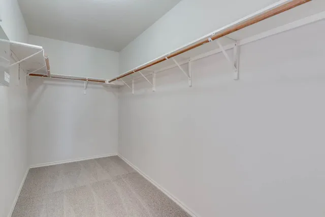 a view of an empty walk in closet