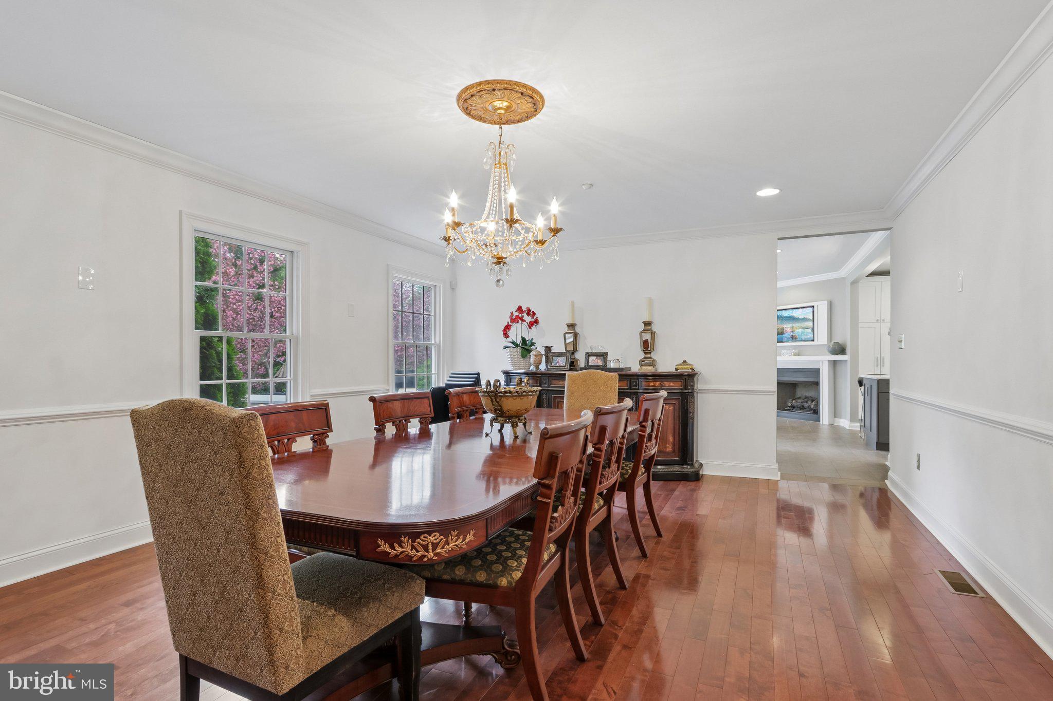 209 Welsh Road Ambler, PA 19002 - Photo 25 of 80 a view of a dining room with furniture wooden floor and chandelier