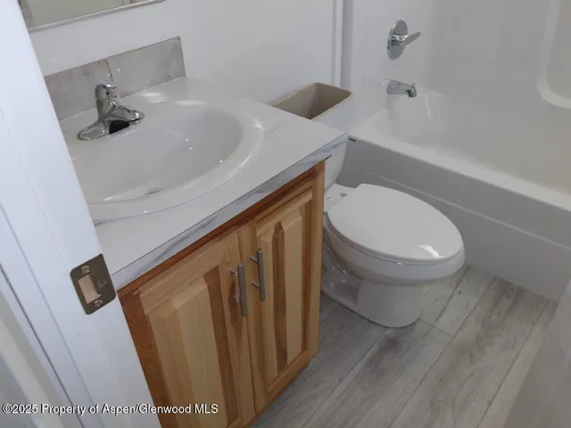 a bathroom with a sink and toilet