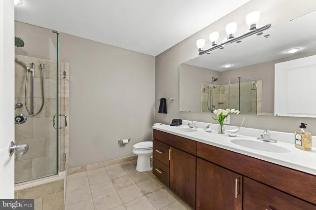 a bedroom with a large bed and a large window