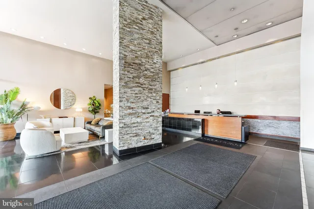 a dining room with furniture window and wooden floor