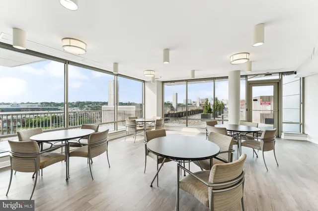 a view of a terrace with wooden benches