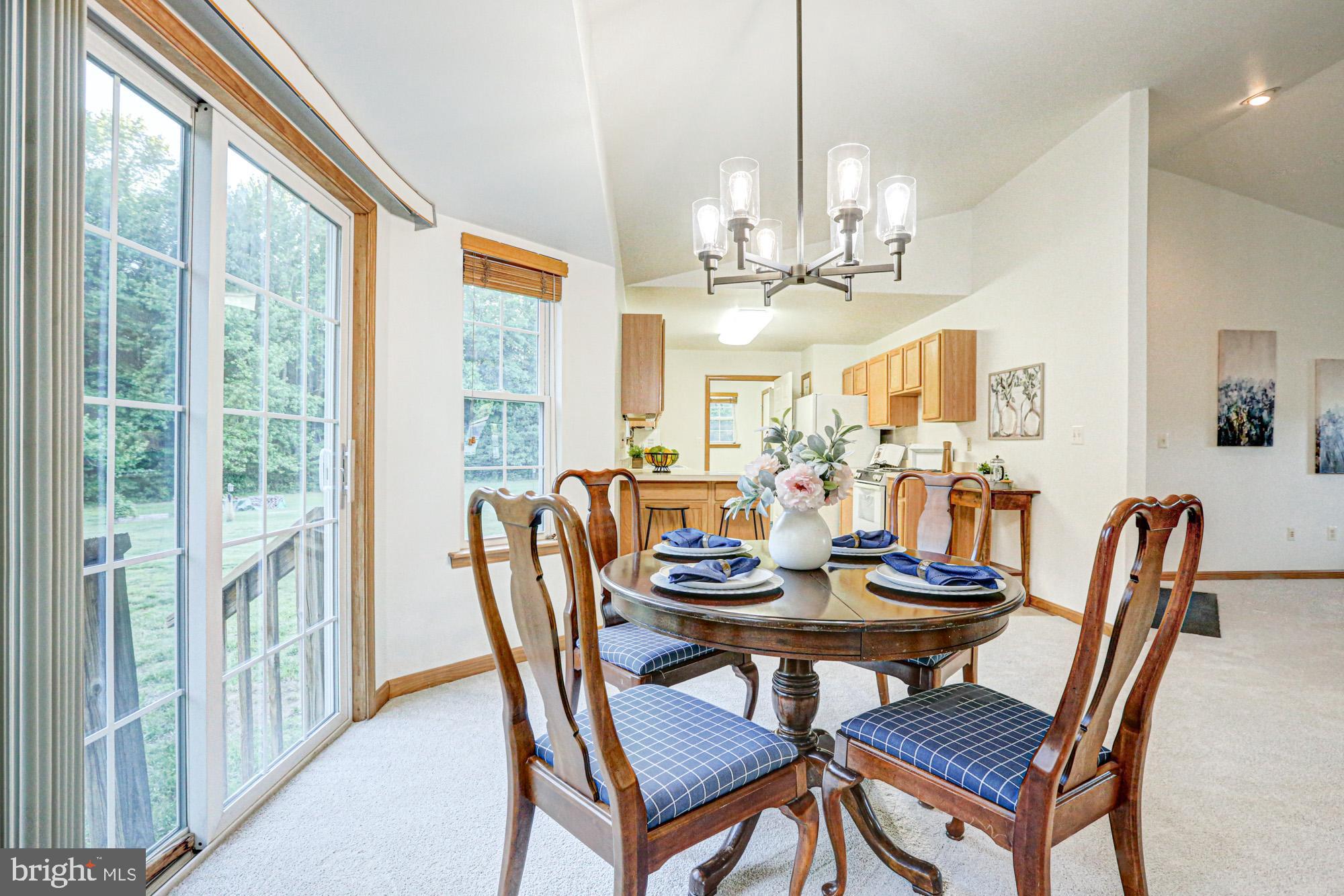 230 Tina Marie Lane Smyrna, DE 19977 - Photo 23 of 83 a view of a dining room with furniture window and outside view