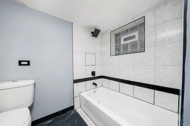 a bathroom with a sink and toilet