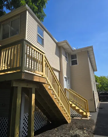 a view of a house with wooden stairs