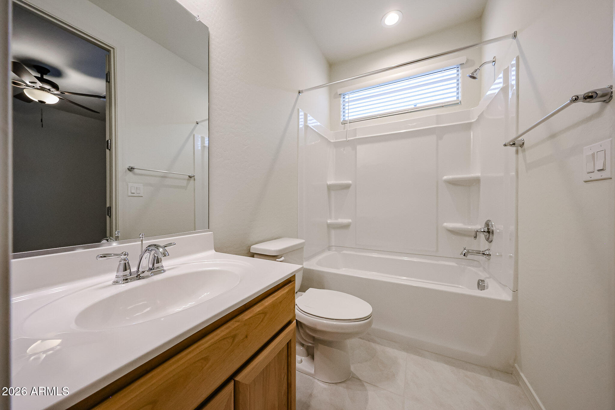 7078 West Plum Road Peoria, AZ 85383 - Photo 17 of 23 a bathroom with a sink a toilet and shower