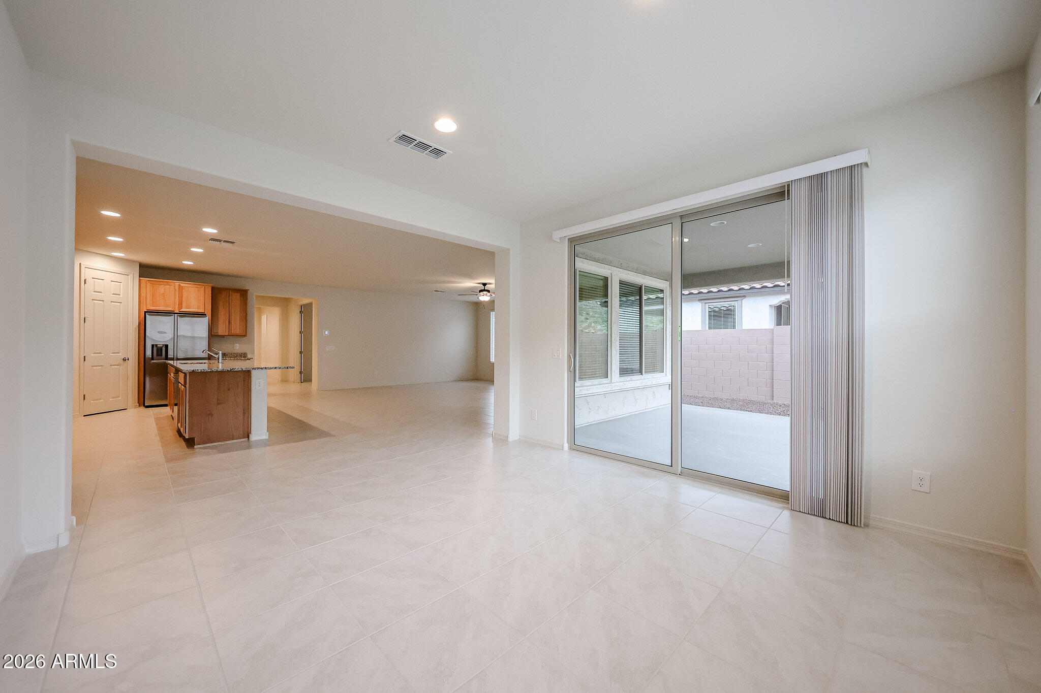 7078 West Plum Road Peoria, AZ 85383 - Photo 5 of 23 a view of a livingroom with furniture and floor to ceiling window