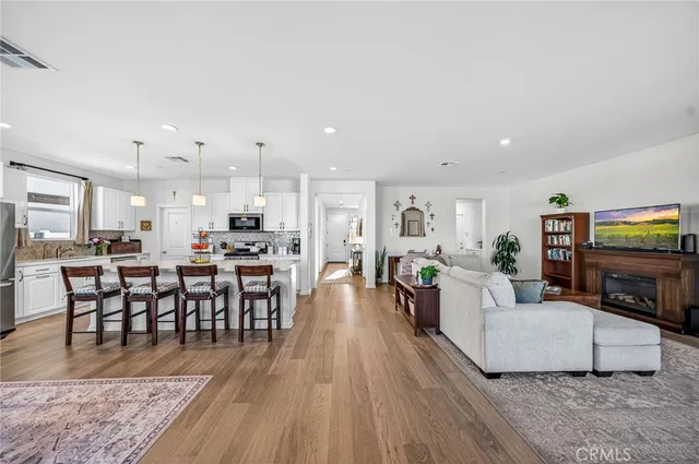 a large kitchen with a table and chairs