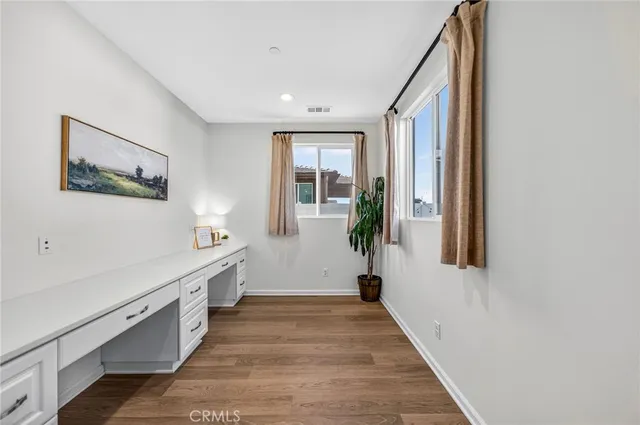 a living room with furniture and white walls