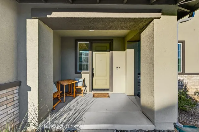 a view of a hallway with a white walls and stairs