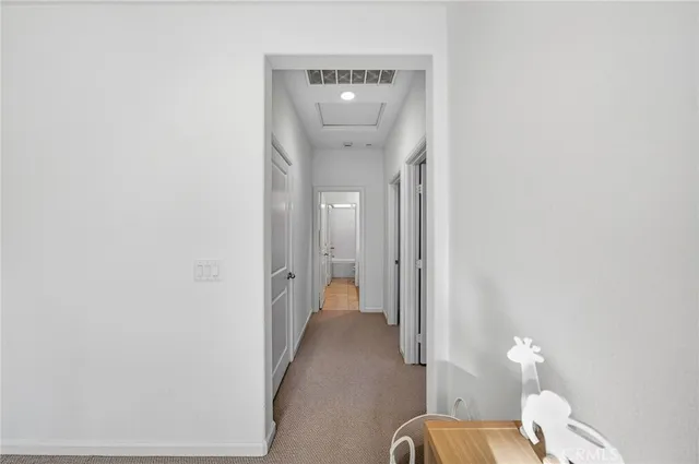 a bed room with a bed and a potted plant