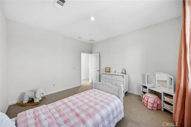 a bedroom with a bed and a table