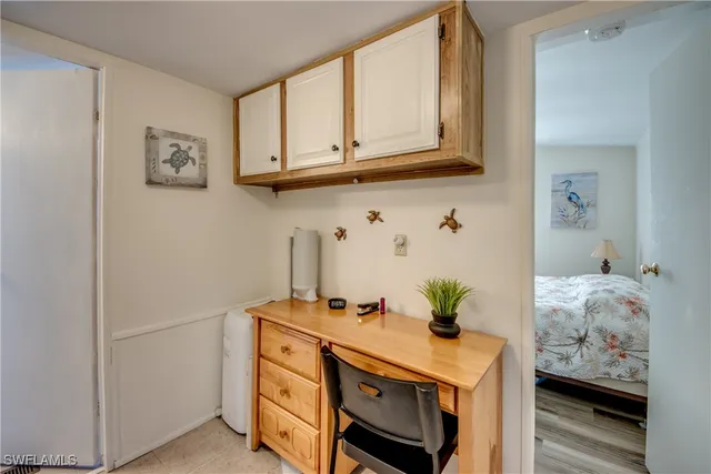 a living room with furniture lamp and rug