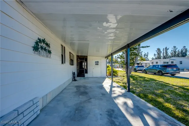 a view of a living room and chandelier