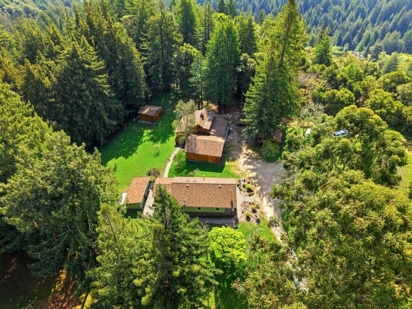 an aerial view of a house with a yard