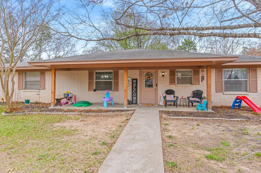 700 Amy Street Canton, TX 75103 - Photo 2 of 35 a front view of a house with porch and outdoor seating