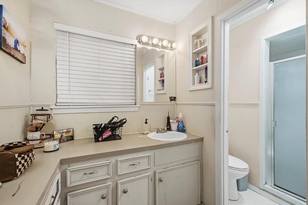700 Amy Street Canton, TX 75103 - Photo 21 of 35 a bathroom with a sink a toilet and vanity