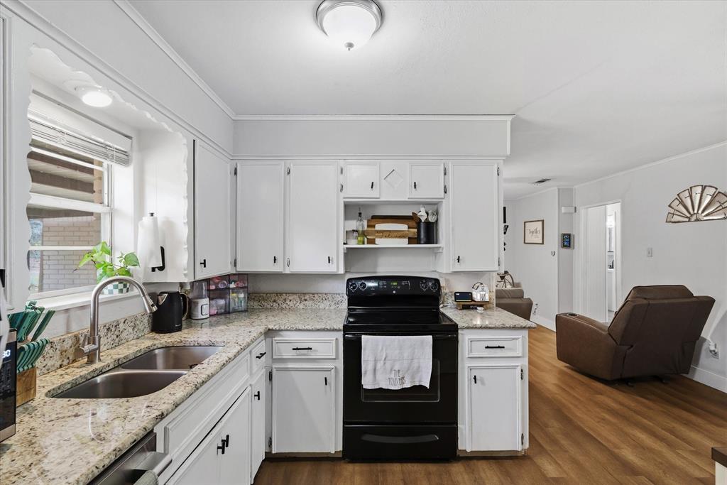 700 Amy Street Canton, TX 75103 - Photo 26 of 35 a kitchen with stainless steel appliances granite countertop a sink stove refrigerator and cabinets