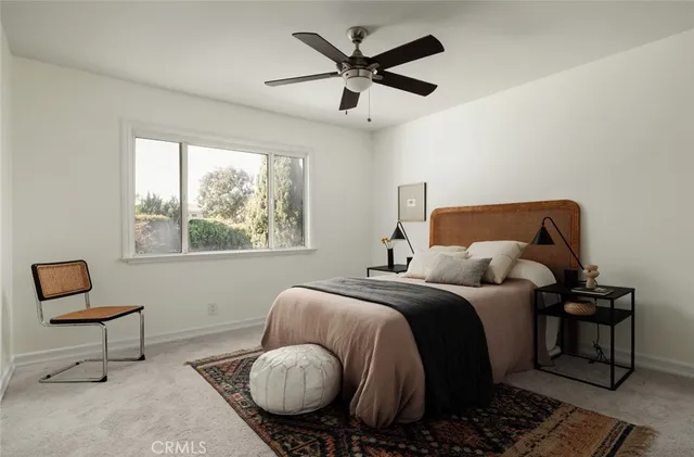 a bedroom with a bed and window