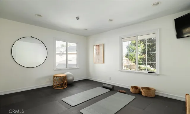 a view of a livingroom with lounge chair and a window