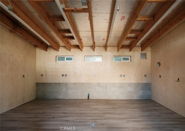 a view of a livingroom with wooden floor