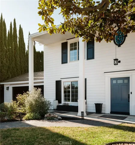 a house with swimming pool in front of it