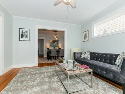 a bedroom with a bed and a chair