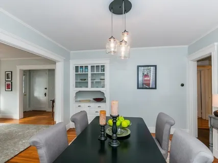 a kitchen with a sink a counter cabinets and appliances