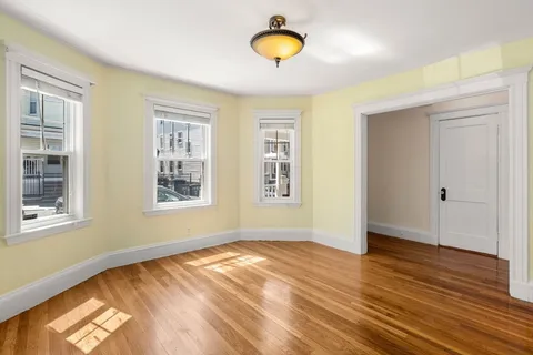 a view of front door with wooden floor