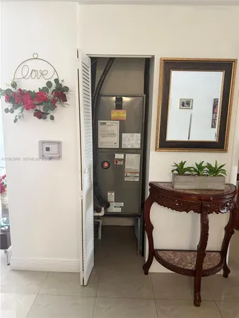 a bedroom with a bed and a table in it