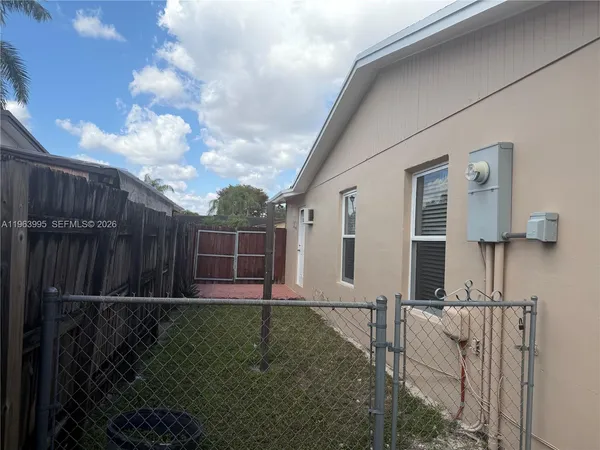 a view of backyard with green space
