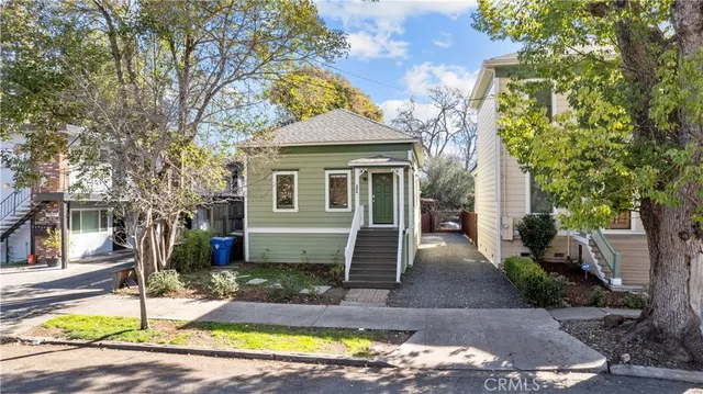 a front view of a house with garden
