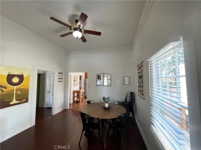 a view of a dining room with furniture and window