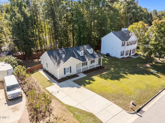 a view of a swimming pool with a yard