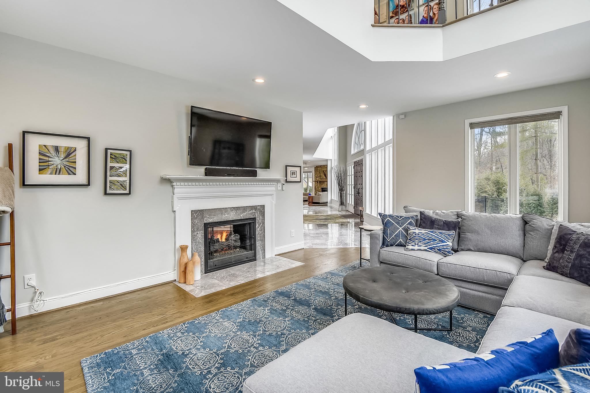 8907 Burdette Road Bethesda, MD 20817 - Photo 13 of 48 Living Room with Double-Sided Gas Fireplace