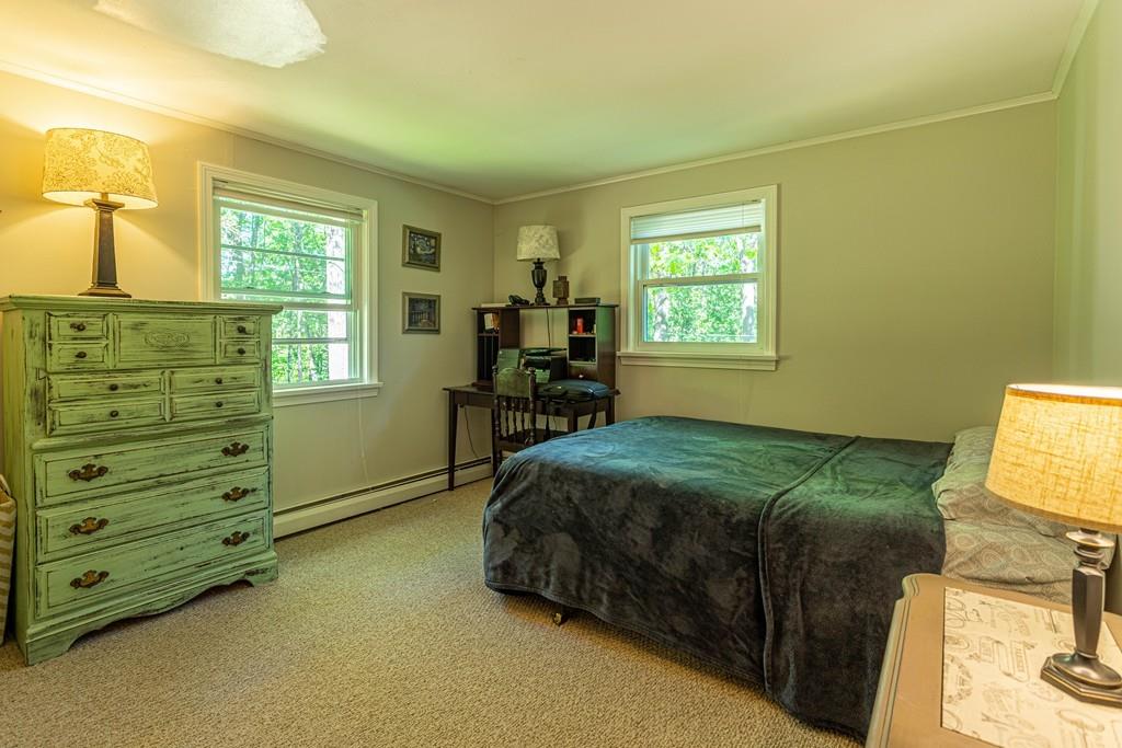 9 Holden Road Shirley, MA 01464 - Photo 24 of 42 a bedroom with a bed and a window