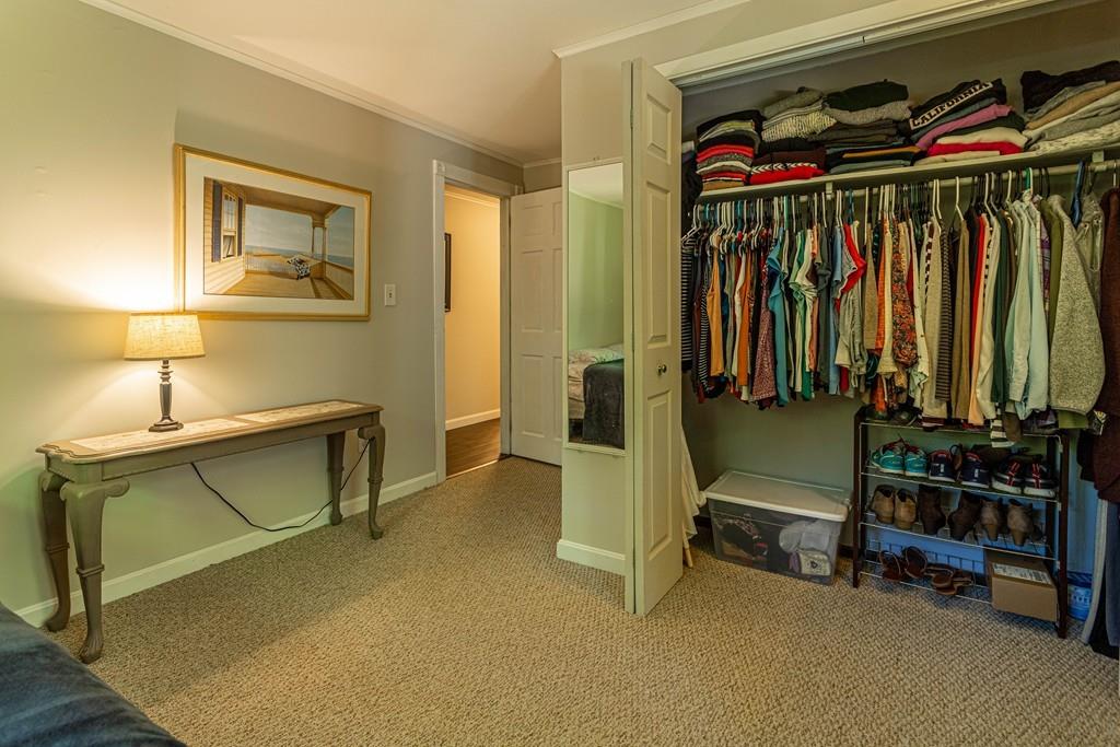 9 Holden Road Shirley, MA 01464 - Photo 26 of 42 a view of walk in closet with clothes and shoes