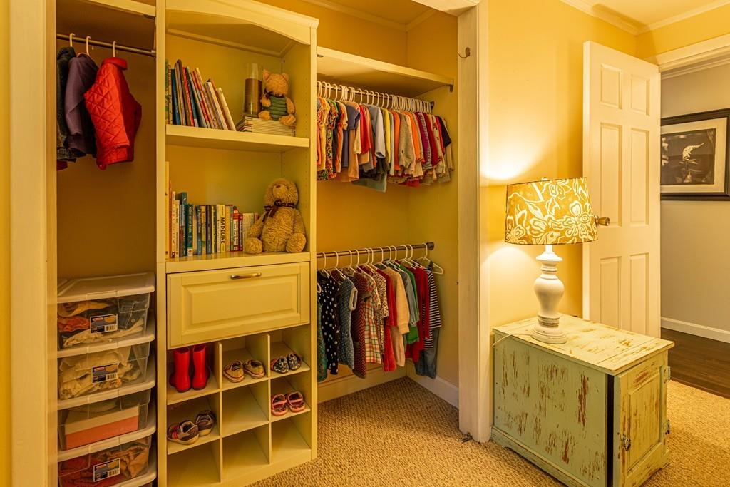 9 Holden Road Shirley, MA 01464 - Photo 29 of 42 a view of walk in closet with clothes and shoes