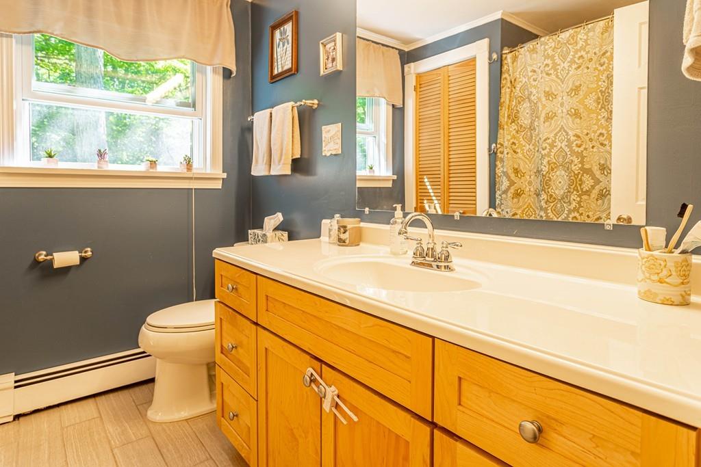 9 Holden Road Shirley, MA 01464 - Photo 30 of 42 a bathroom with a sink a toilet and a mirror