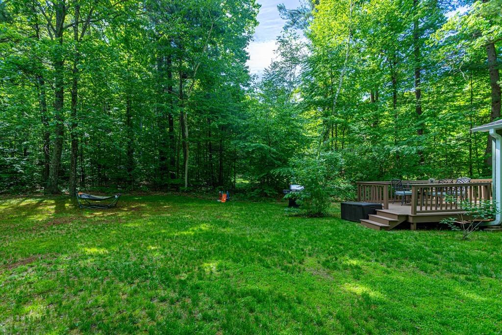 9 Holden Road Shirley, MA 01464 - Photo 42 of 42 a view of a house with a backyard and a wooden deck